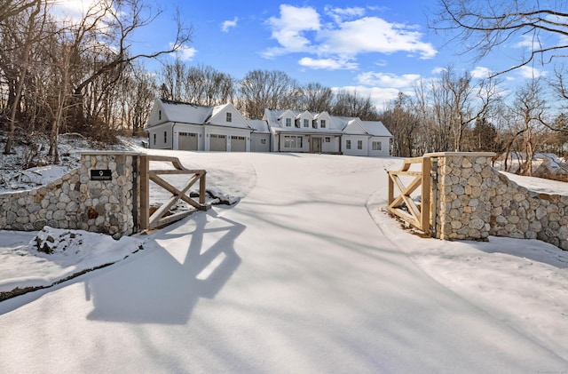 yard covered in snow with a garage