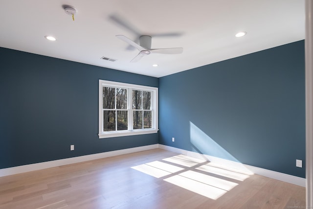 empty room featuring ceiling fan and light wood-type flooring