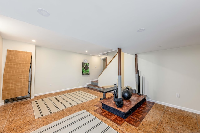 exercise room featuring parquet floors