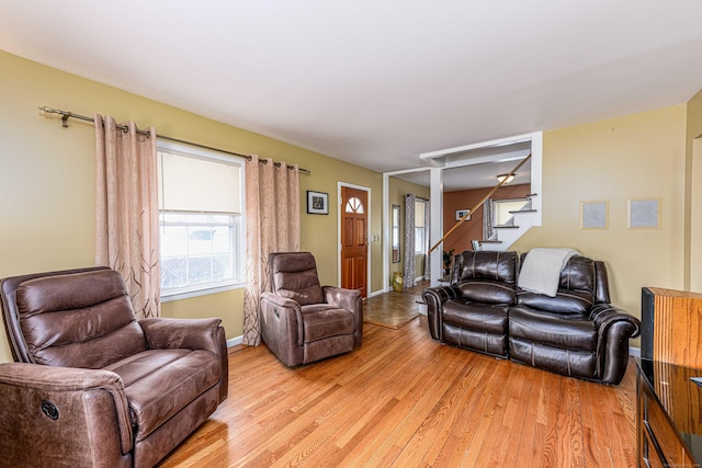 living room with light hardwood / wood-style flooring