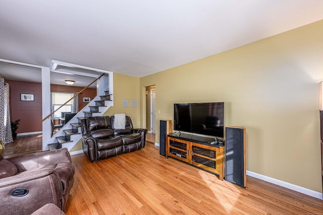 living room with light hardwood / wood-style flooring