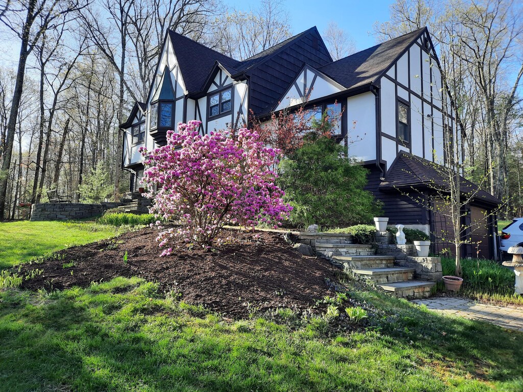 view of property exterior featuring a yard