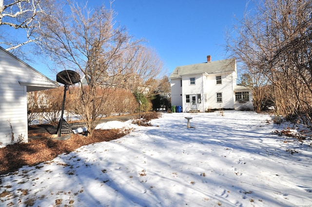 view of snow covered house