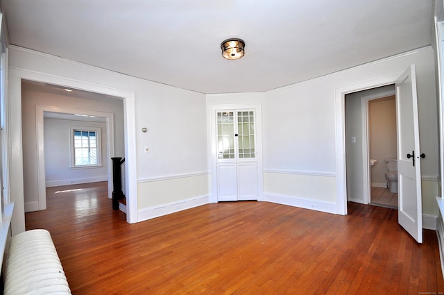 spare room featuring dark wood-type flooring