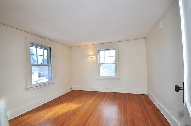 spare room featuring hardwood / wood-style floors