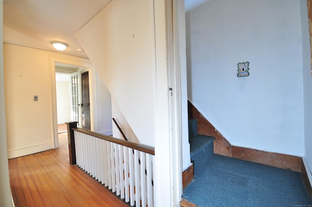 hall with wood-type flooring