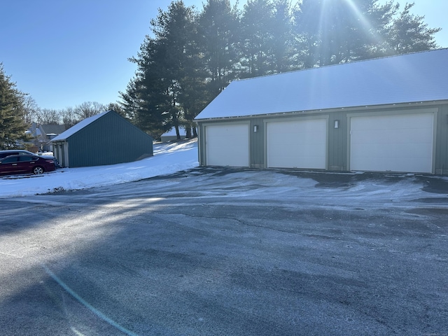 view of snow covered garage