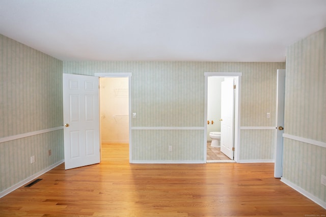 unfurnished room featuring light wood-type flooring