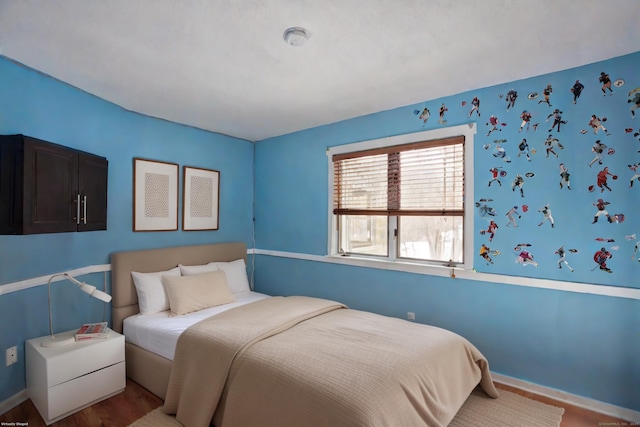 bedroom with wood-type flooring