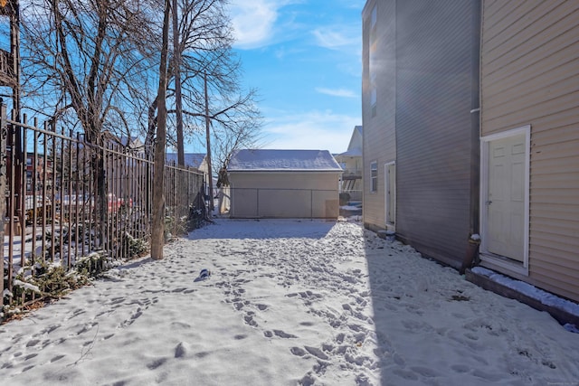 view of yard layered in snow