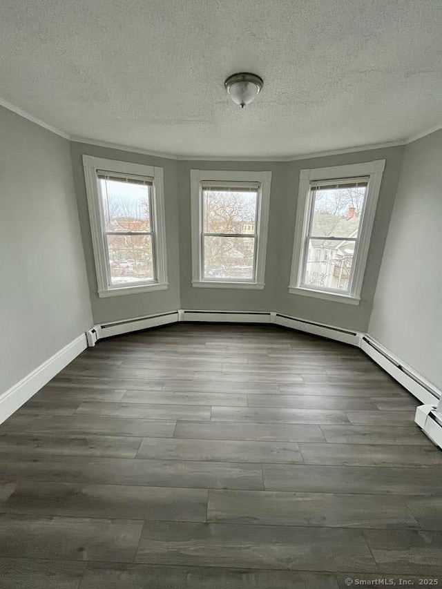 unfurnished room featuring dark wood-type flooring and a textured ceiling