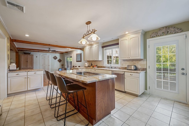 kitchen with beam ceiling, light stone counters, a kitchen island, decorative light fixtures, and stainless steel dishwasher