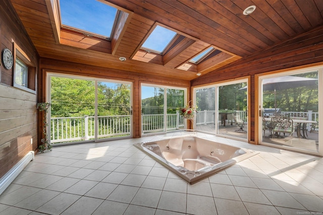 unfurnished sunroom with a jacuzzi, wooden ceiling, and vaulted ceiling with skylight