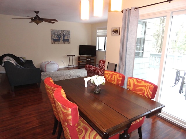 dining room with dark wood-type flooring and ceiling fan