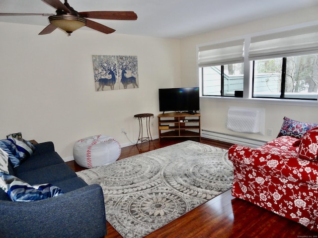 living room featuring hardwood / wood-style flooring, ceiling fan, and baseboard heating