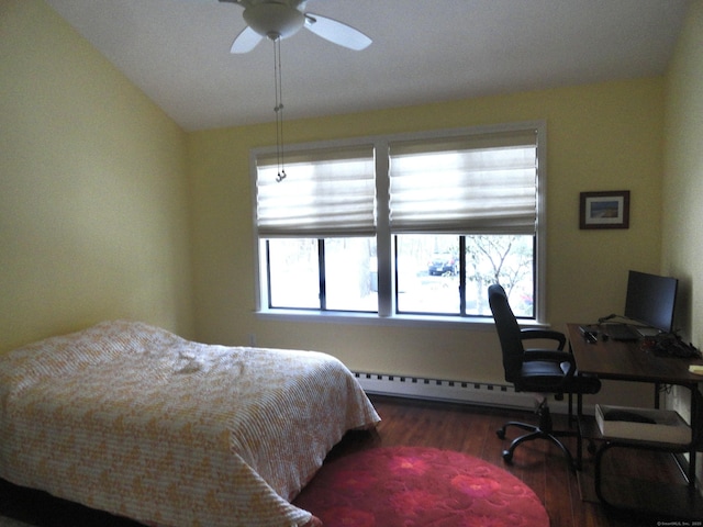 bedroom with hardwood / wood-style floors, vaulted ceiling, ceiling fan, and a baseboard heating unit