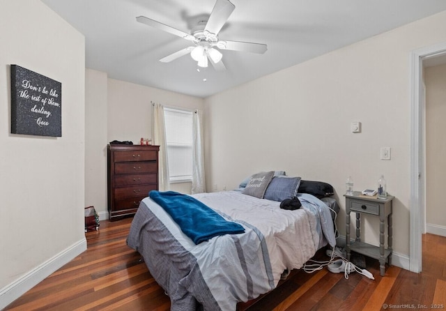 bedroom featuring dark hardwood / wood-style floors and ceiling fan