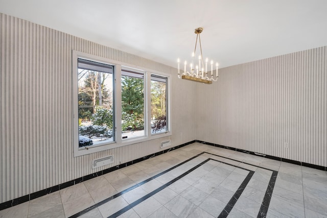 unfurnished room featuring wallpapered walls, visible vents, baseboards, and a chandelier