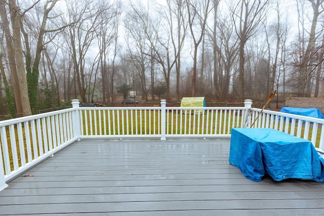 wooden terrace with a yard