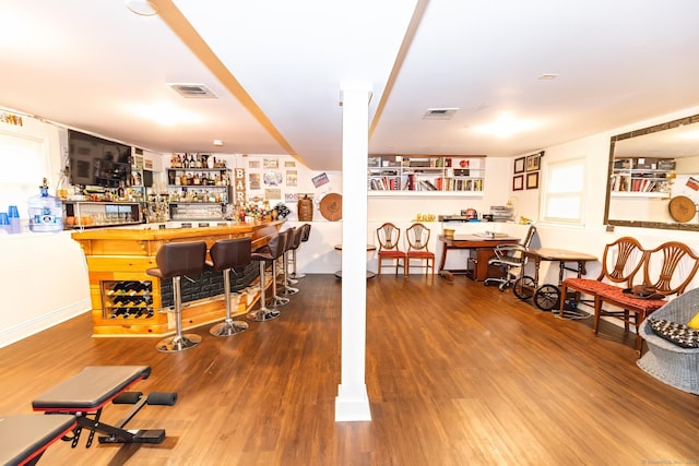 bar featuring hardwood / wood-style floors