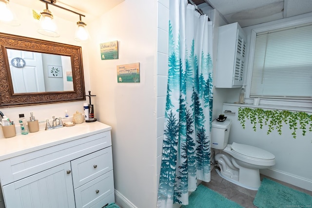 bathroom featuring tile patterned flooring, vanity, walk in shower, and toilet