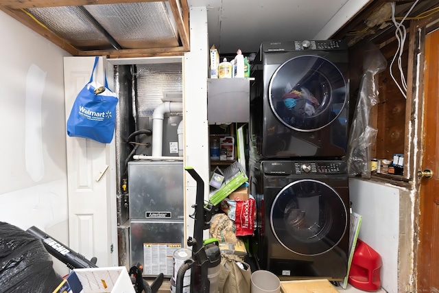 laundry area with stacked washer and clothes dryer