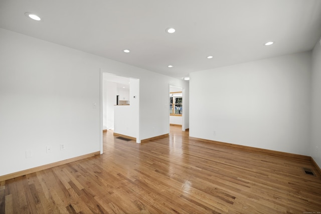 spare room with light wood-type flooring