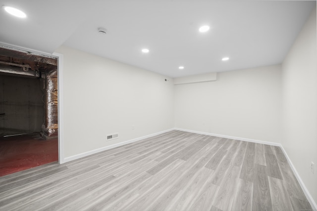 spare room featuring light hardwood / wood-style floors