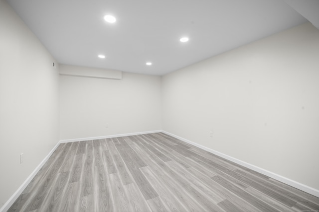 spare room with light hardwood / wood-style flooring