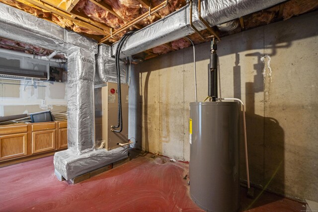 utility room featuring gas water heater