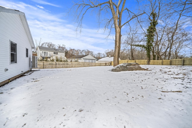 view of yard covered in snow