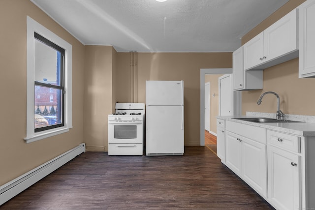 kitchen with baseboard heating, white appliances, sink, and white cabinets