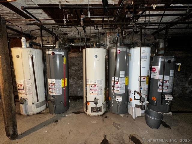 utility room featuring gas water heater