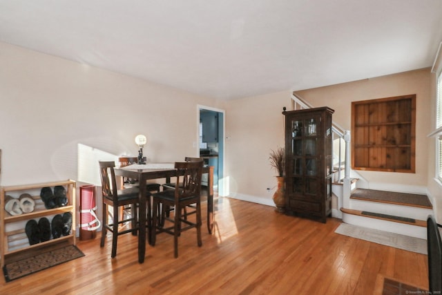 dining space featuring hardwood / wood-style floors