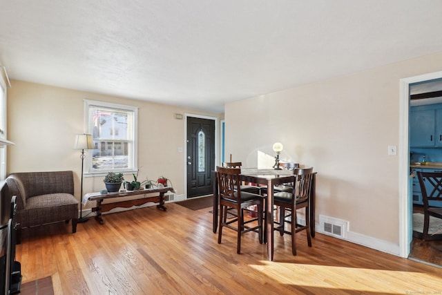 dining area with hardwood / wood-style flooring