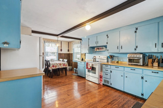 kitchen with pendant lighting, blue cabinets, white electric range oven, and beam ceiling