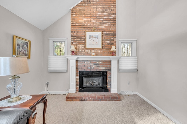 living room featuring a fireplace, high vaulted ceiling, and carpet