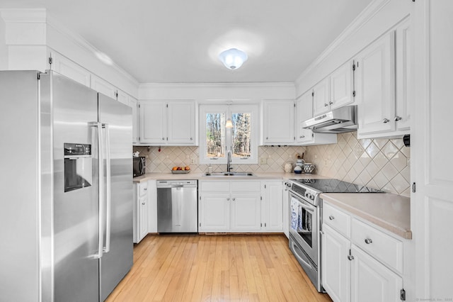 kitchen with sink, light hardwood / wood-style flooring, stainless steel appliances, and white cabinets