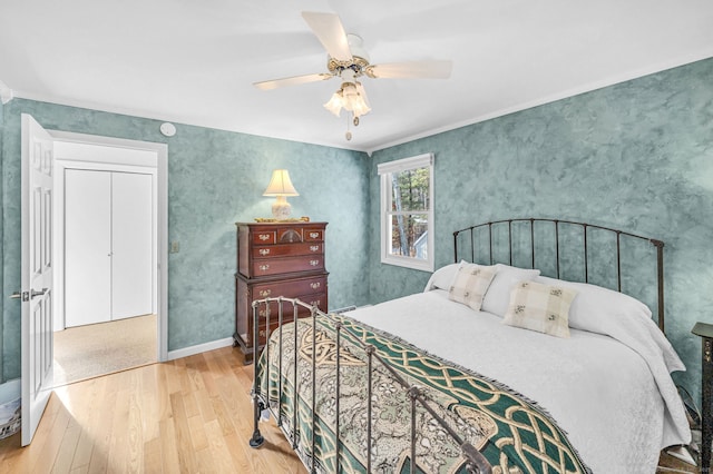 bedroom with ceiling fan and light hardwood / wood-style flooring