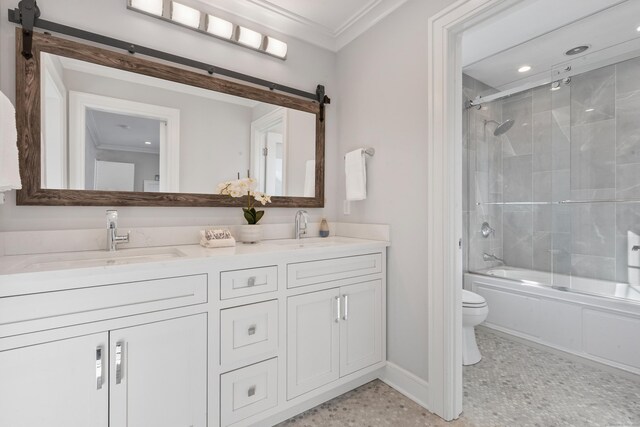 full bathroom featuring vanity, ornamental molding, enclosed tub / shower combo, and toilet