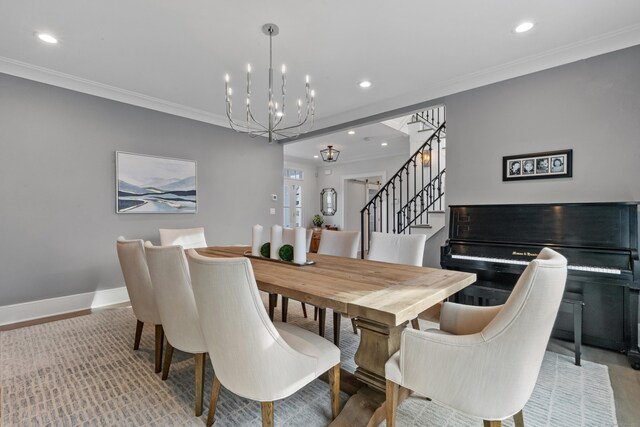 dining room with ornamental molding and a chandelier