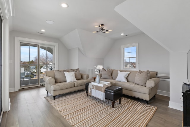 living room with vaulted ceiling and hardwood / wood-style floors