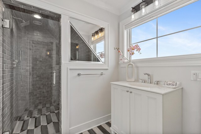 bathroom featuring walk in shower and vanity