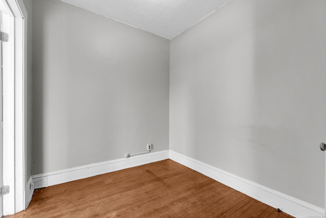 empty room with wood-type flooring