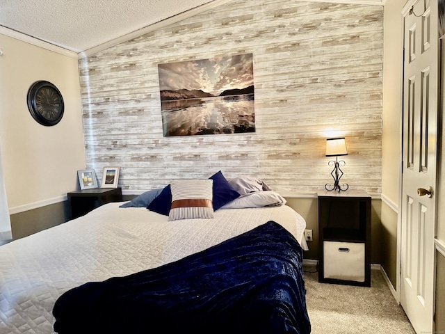 carpeted bedroom featuring crown molding, vaulted ceiling, a textured ceiling, and wood walls