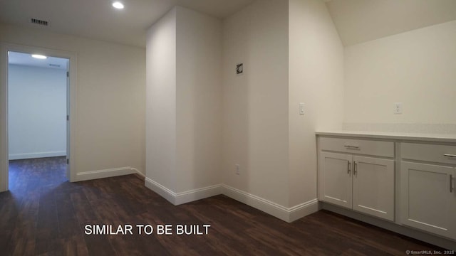 hall with dark wood-type flooring