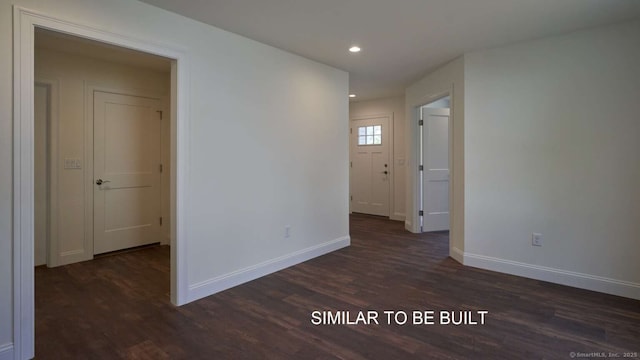 unfurnished room featuring dark hardwood / wood-style flooring