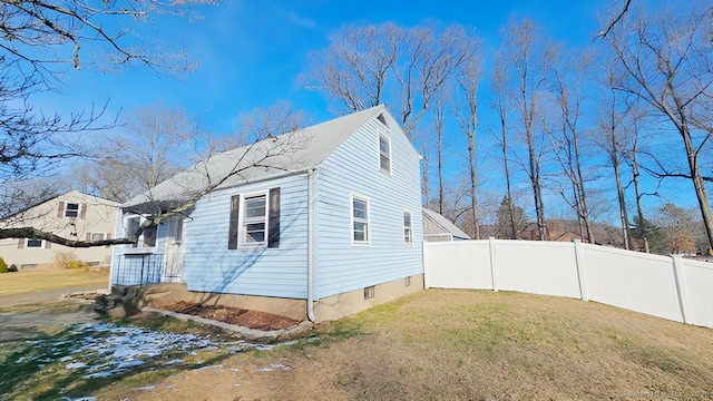 view of home's exterior with a lawn