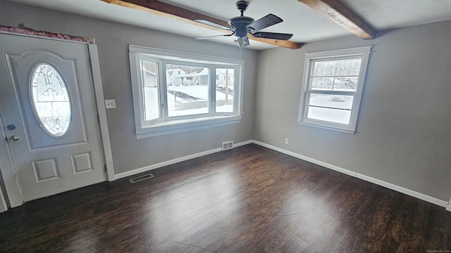 entryway with dark hardwood / wood-style flooring, beam ceiling, and ceiling fan