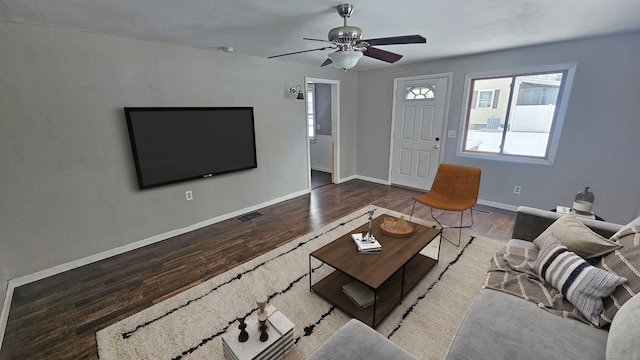 unfurnished living room with ceiling fan and dark hardwood / wood-style floors